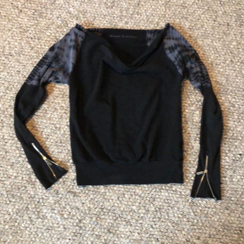 Black sweater, shoulder tie- dyed with zipper bottom sleeve. Slight cowl neck